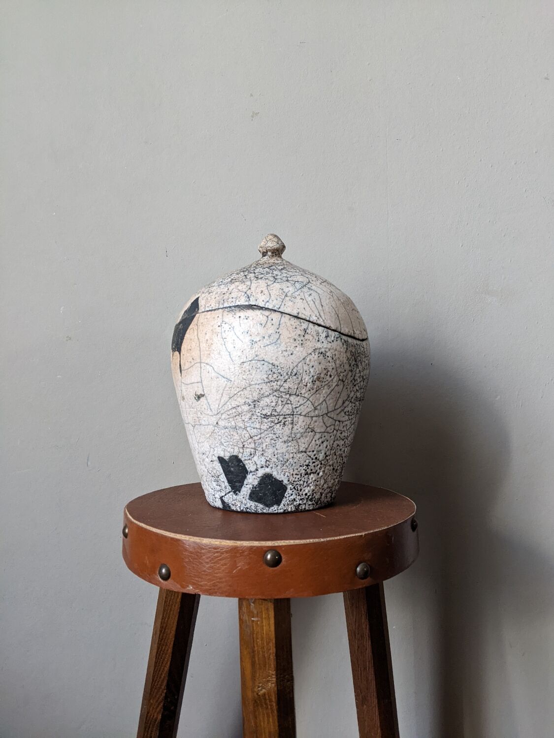 Handmade raku ceramic pot in contemporary Japandi design.