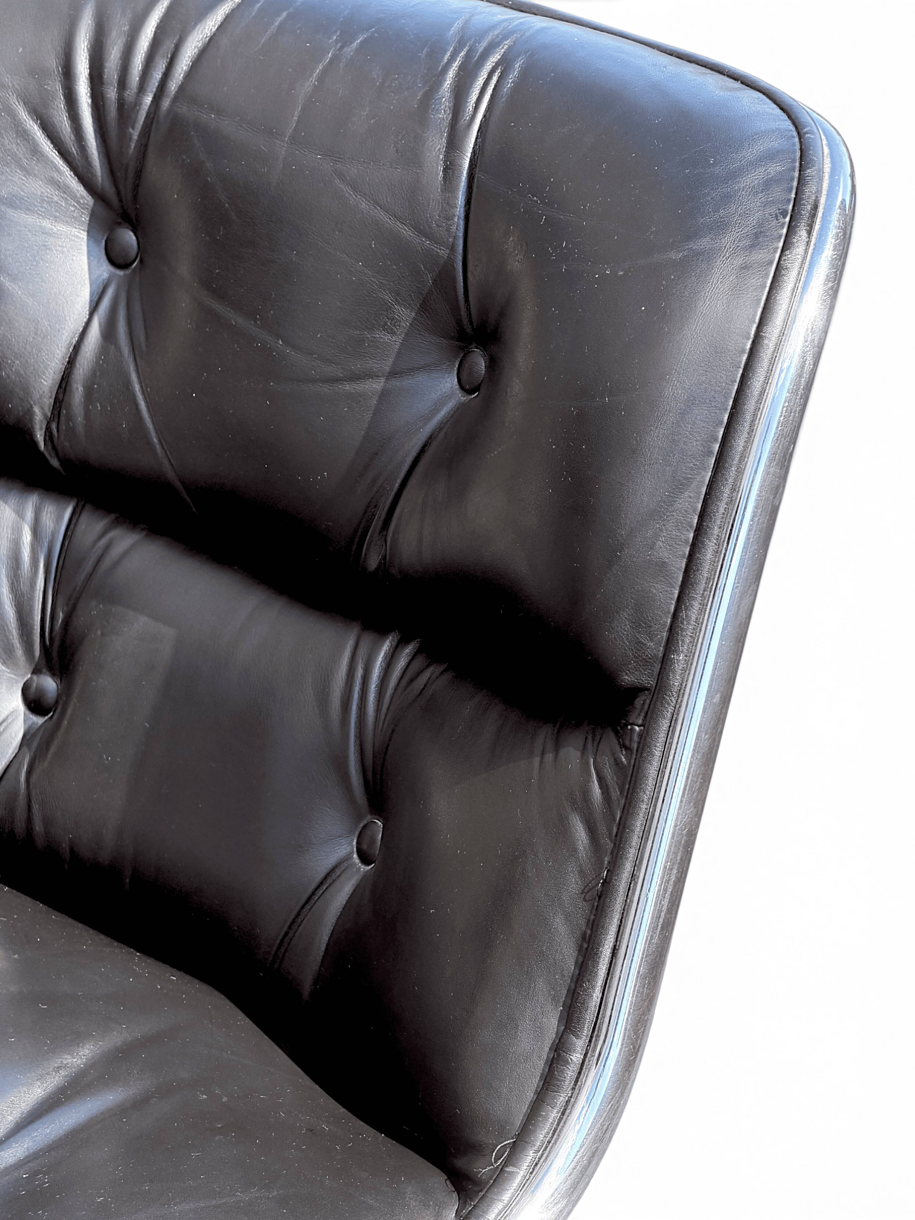 Charles Pollock Knoll office chair in black leather without armrests.