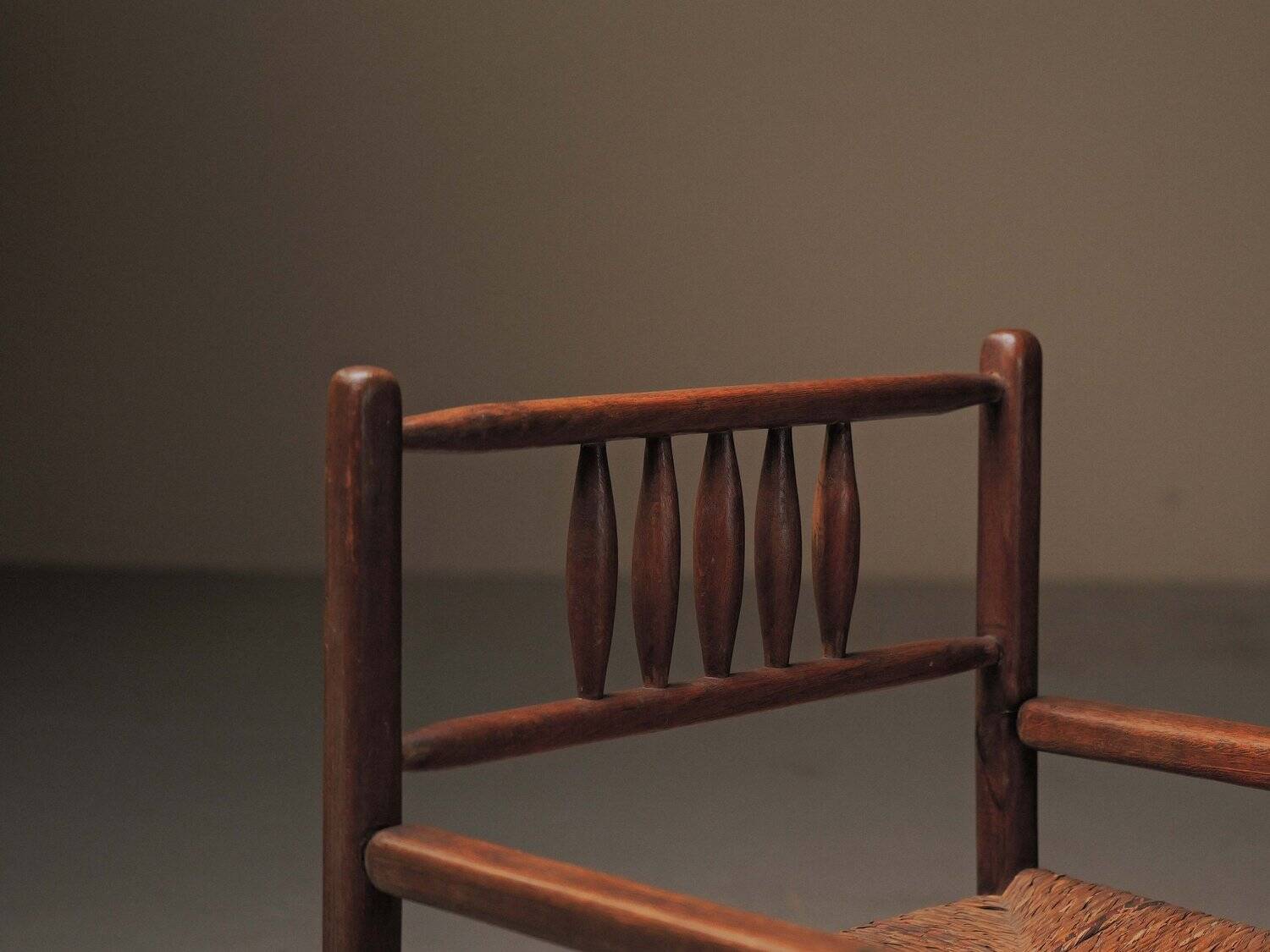 Wicker armchair in solid wood, handcrafted, France, around 1950.