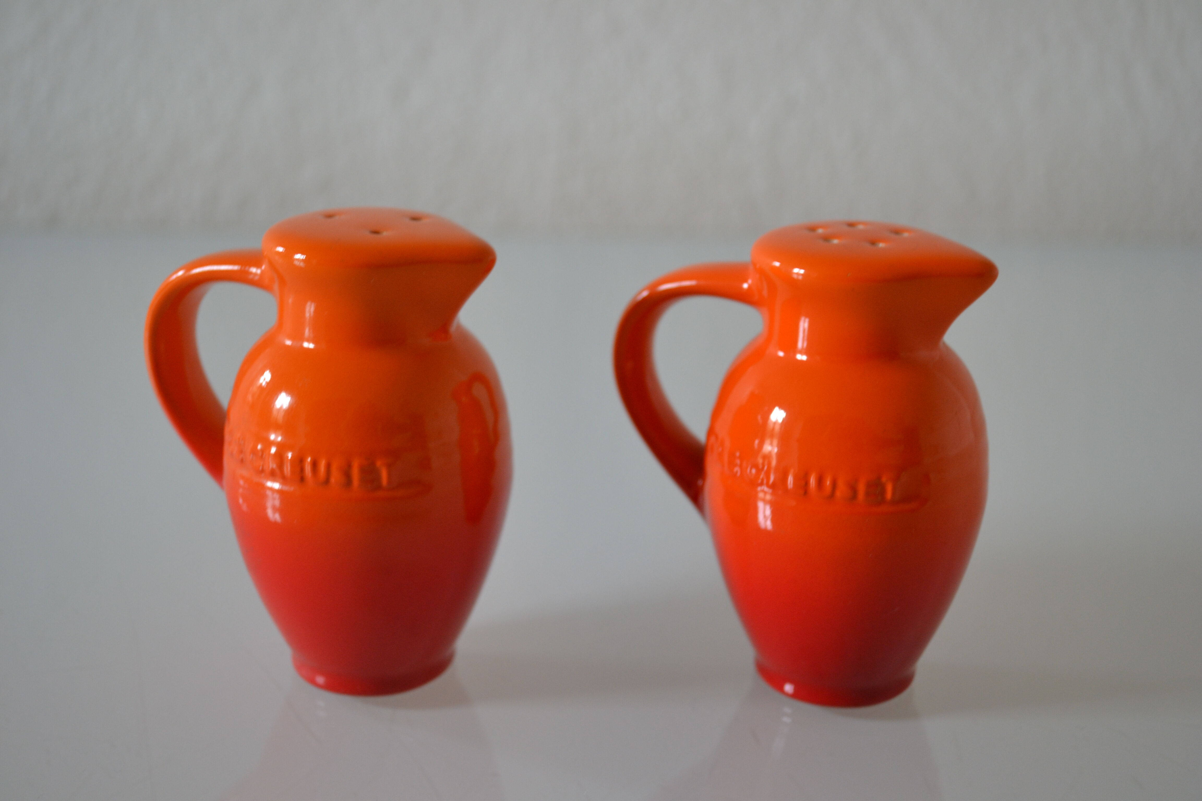 Le Creuset orange advertising salt and pepper