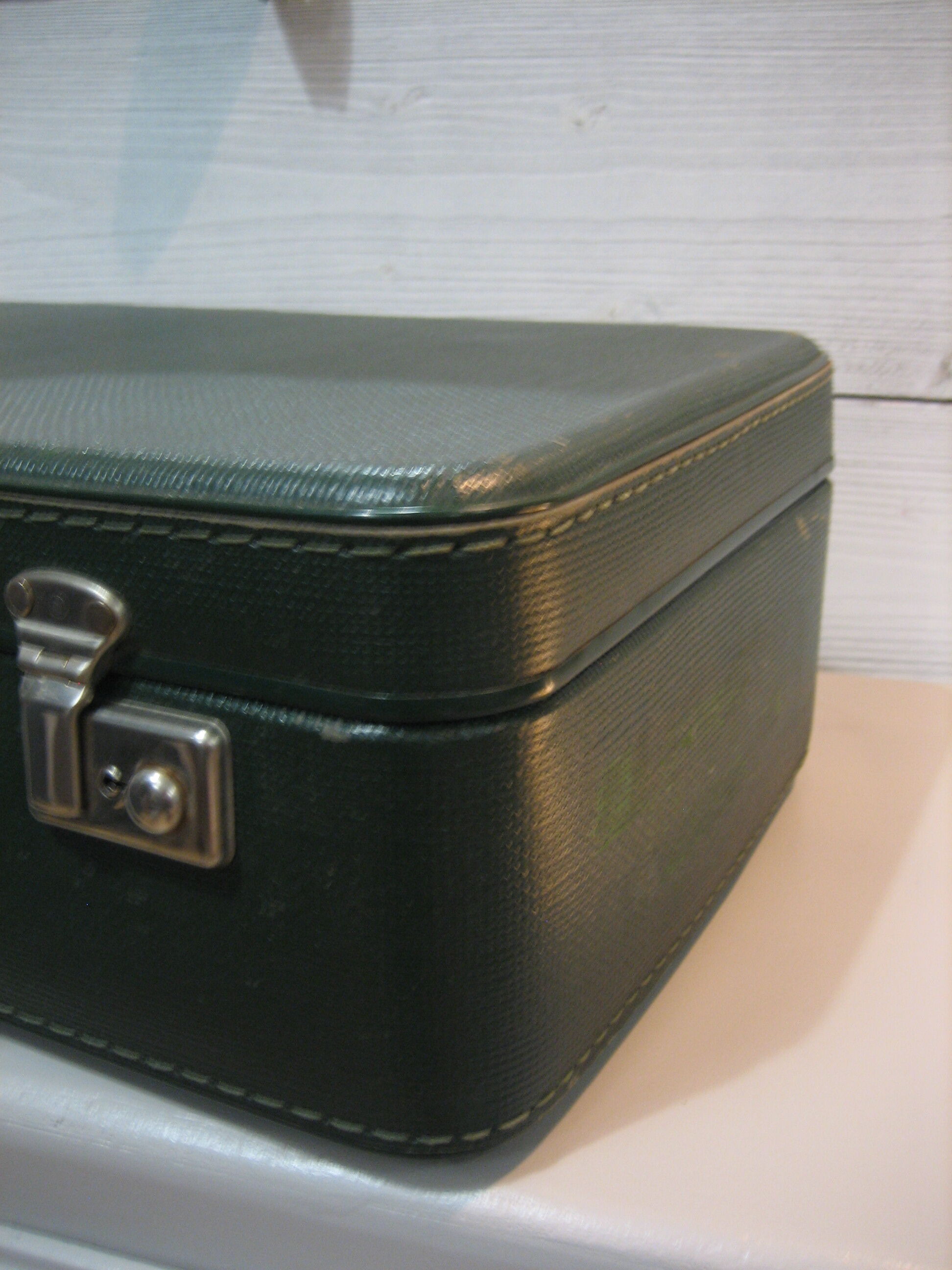 Dark green suitcase