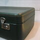 Dark green suitcase