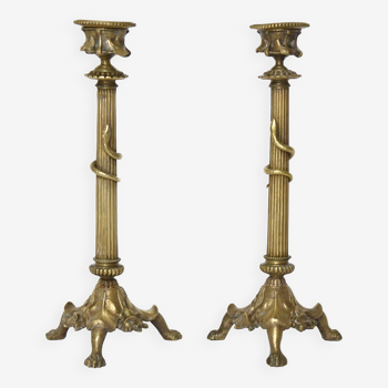 Pair of gilded bronze candlesticks decorated with a snake