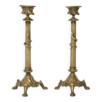 Pair of gilded bronze candlesticks decorated with a snake