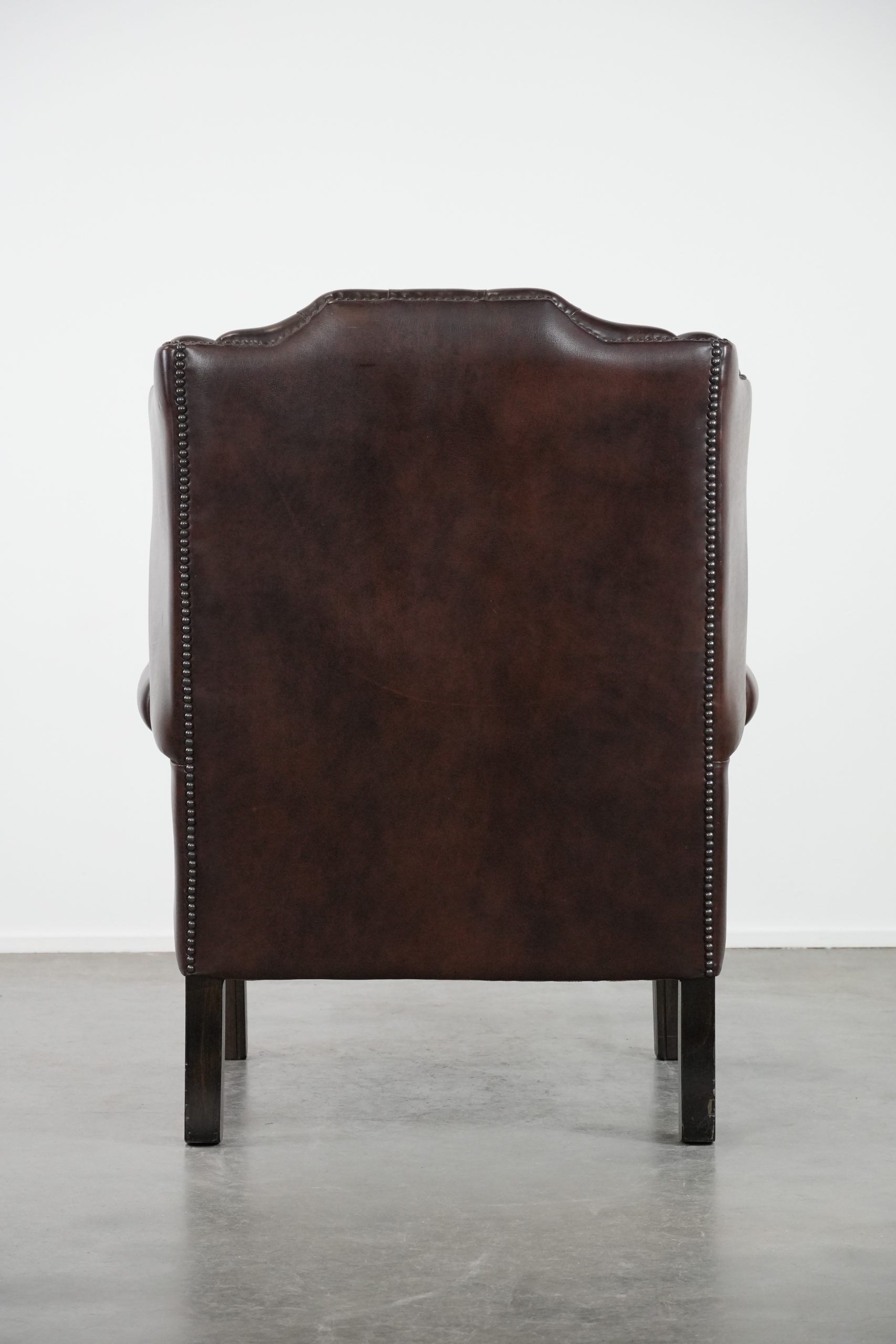 Brown cowhide leather Chesterfield wingback armchair in English style