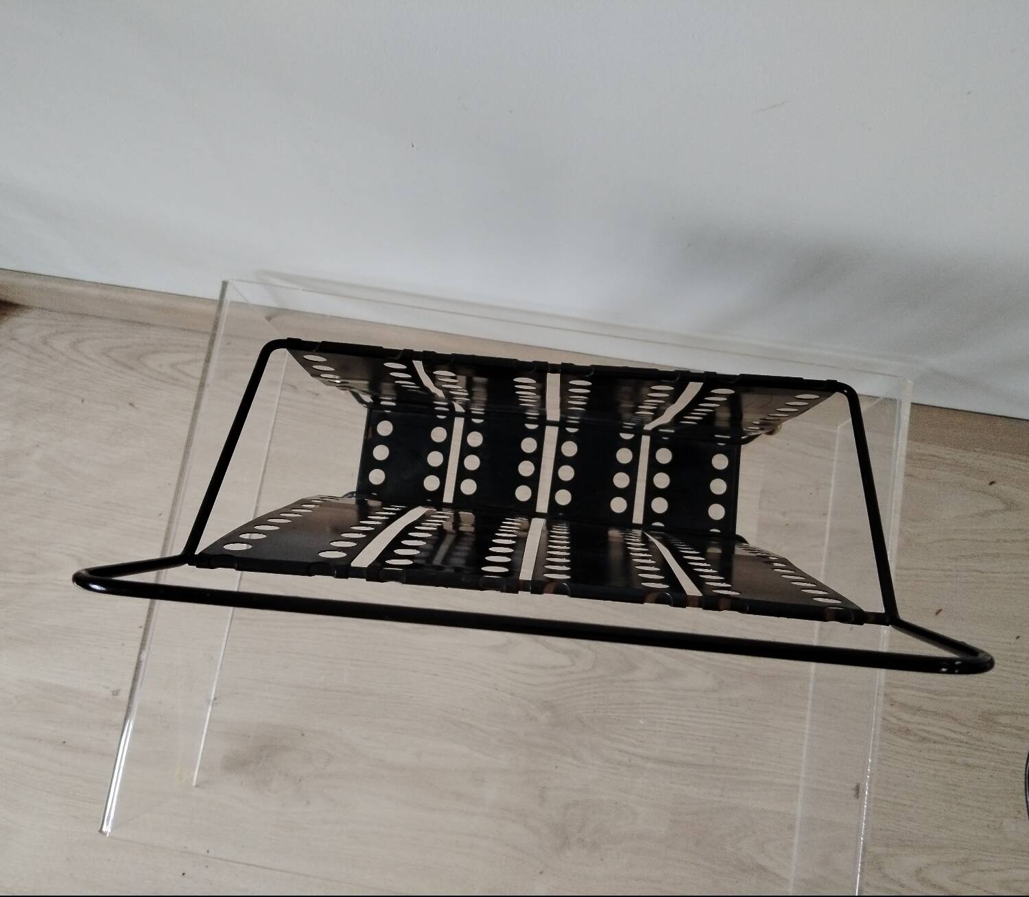 “Santiago” magazine rack in perforated sheet metal Mathieu Mategot 1950s