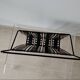 “Santiago” magazine rack in perforated sheet metal Mathieu Mategot 1950s