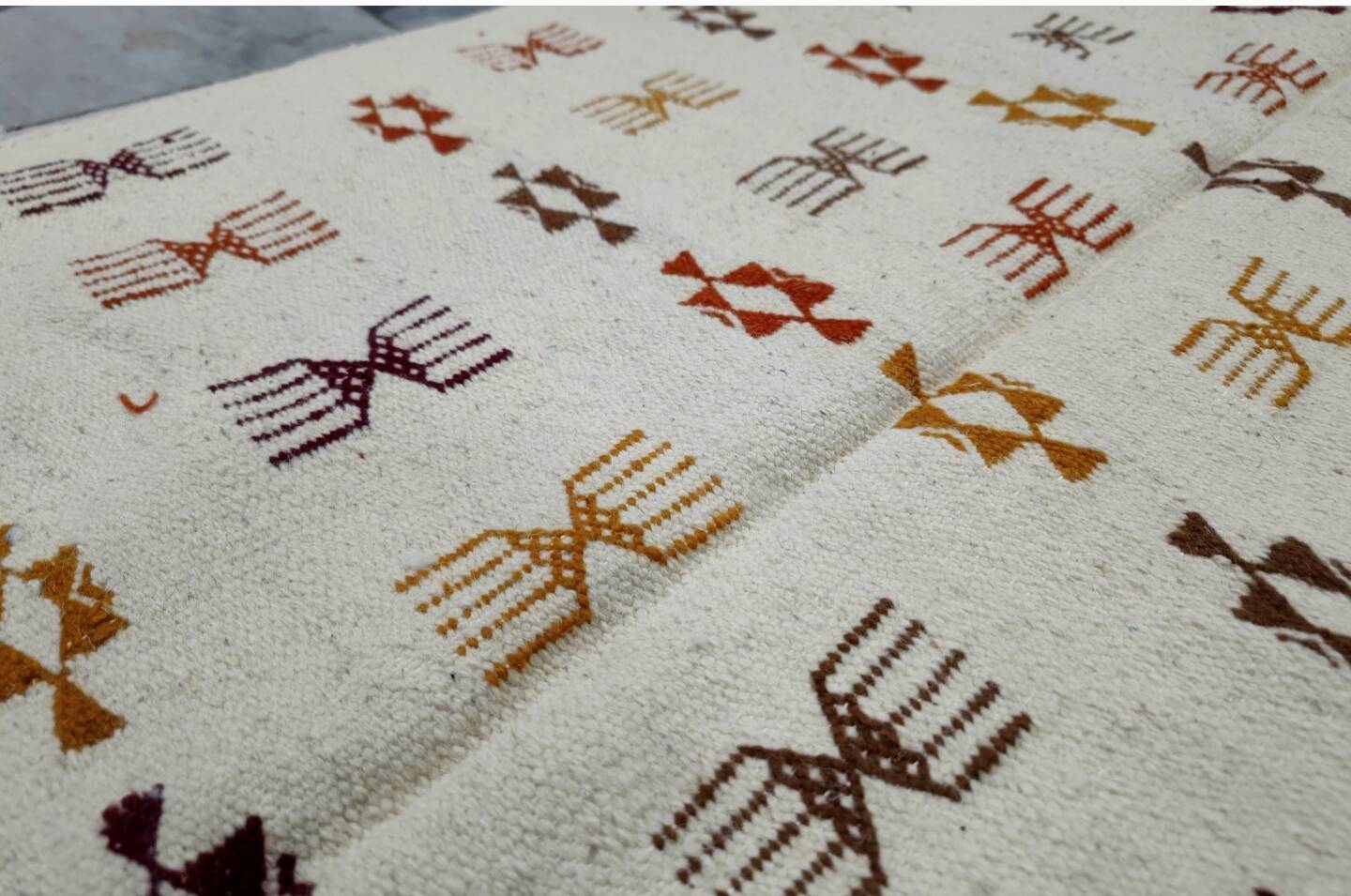 Handmade Berber patterned rug in natural wool