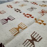 Handmade Berber patterned rug in natural wool