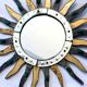 Sun-shaped mirror, wooden frame, circa 1980.