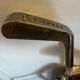 Golf bag filled with 5 vintage clubs