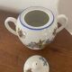 Large sugar bowl with floral porcelain.