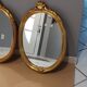 Paire de miroirs oval  doré vintage