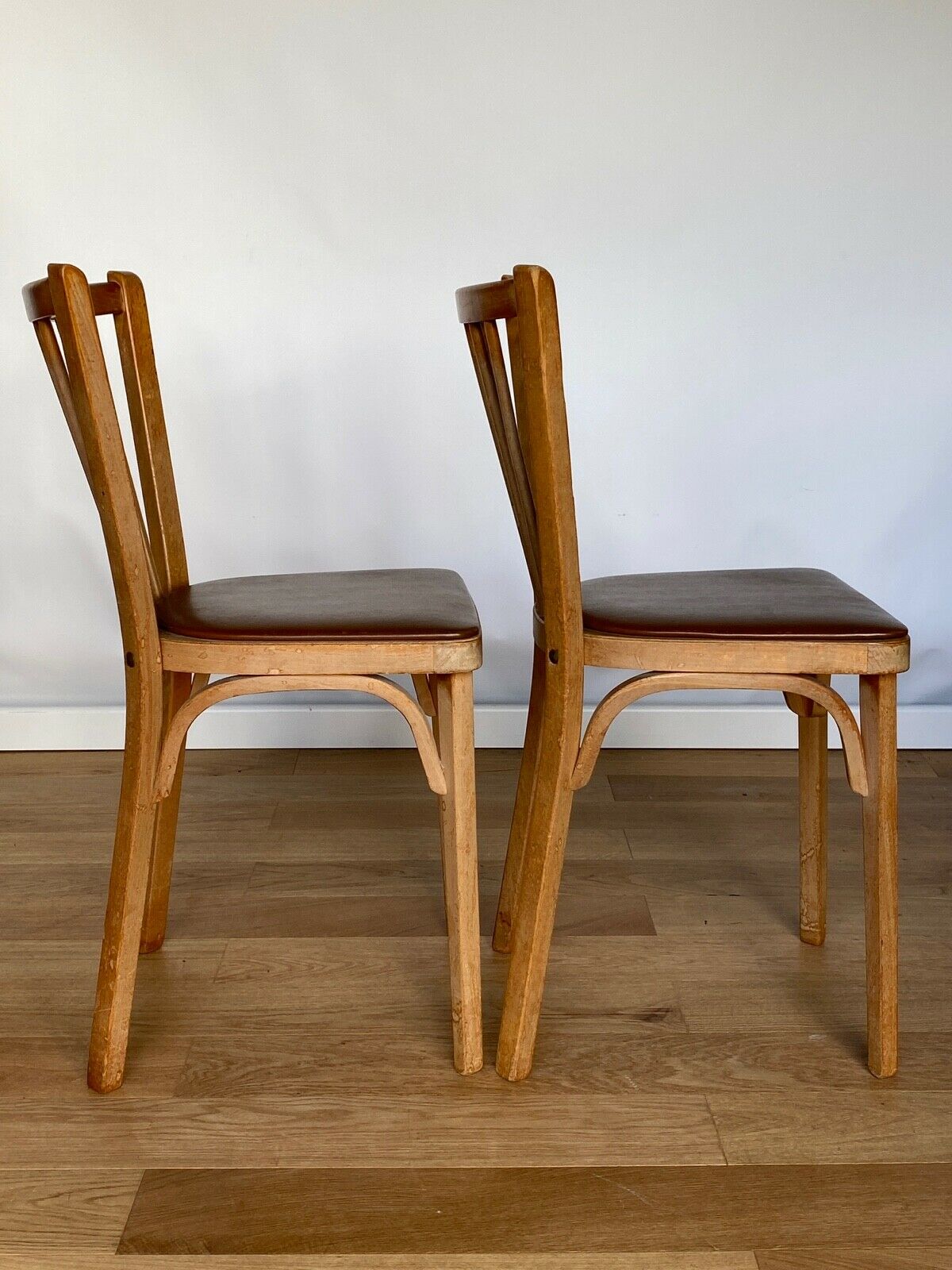 Four chairs Baumann 1960 with bars seated skaï brown label