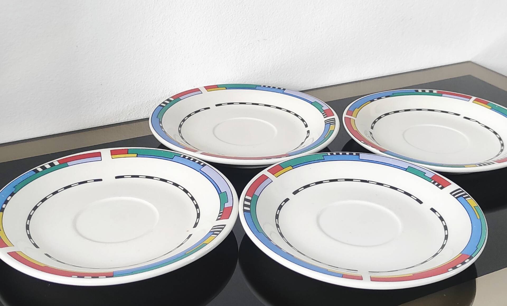 Set of small plates, vintage saucers in porcelain.
