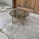 Vintage round coffee table in gilded brass with a glass top - 1970s