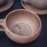 4 stoneware cups and sub-cups
