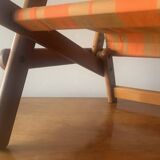 Old foldable beach seat in wood and canvas for children