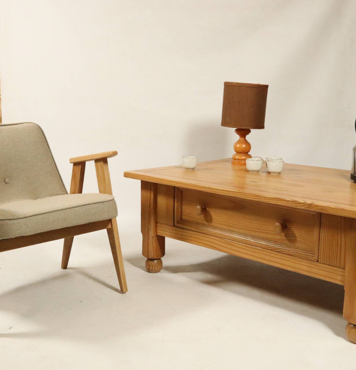 Rustic vintage style coffee table in light wood, mid-century modern design.
