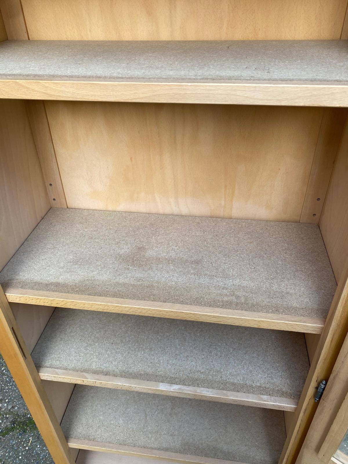 Parisian glass-fronted wardrobe in light wood from the 1960s.