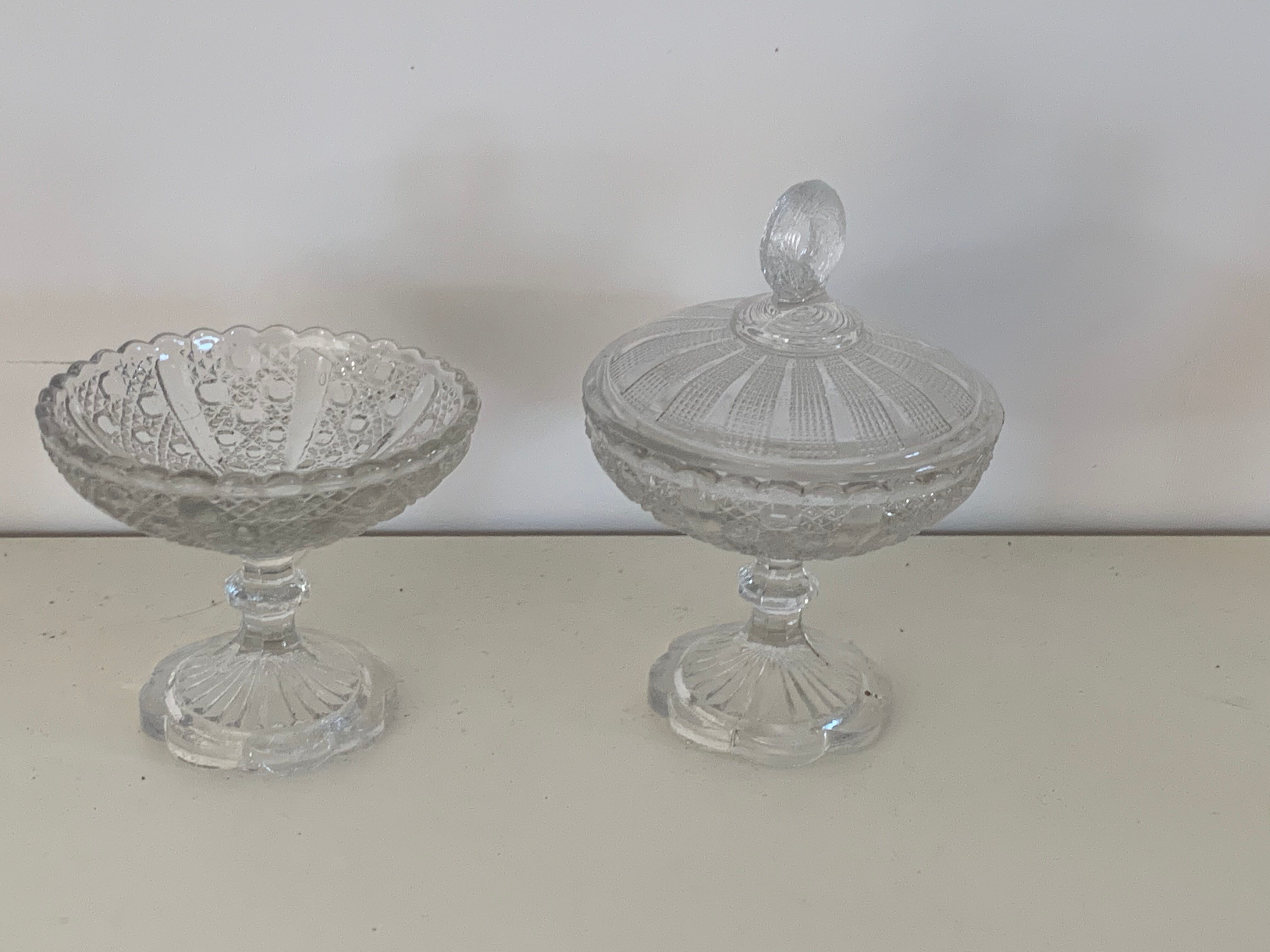 Two dredged cups in transparent glass geometric patterns in old relief