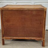 Chest of drawers made of wood, rattan and bamboo.
