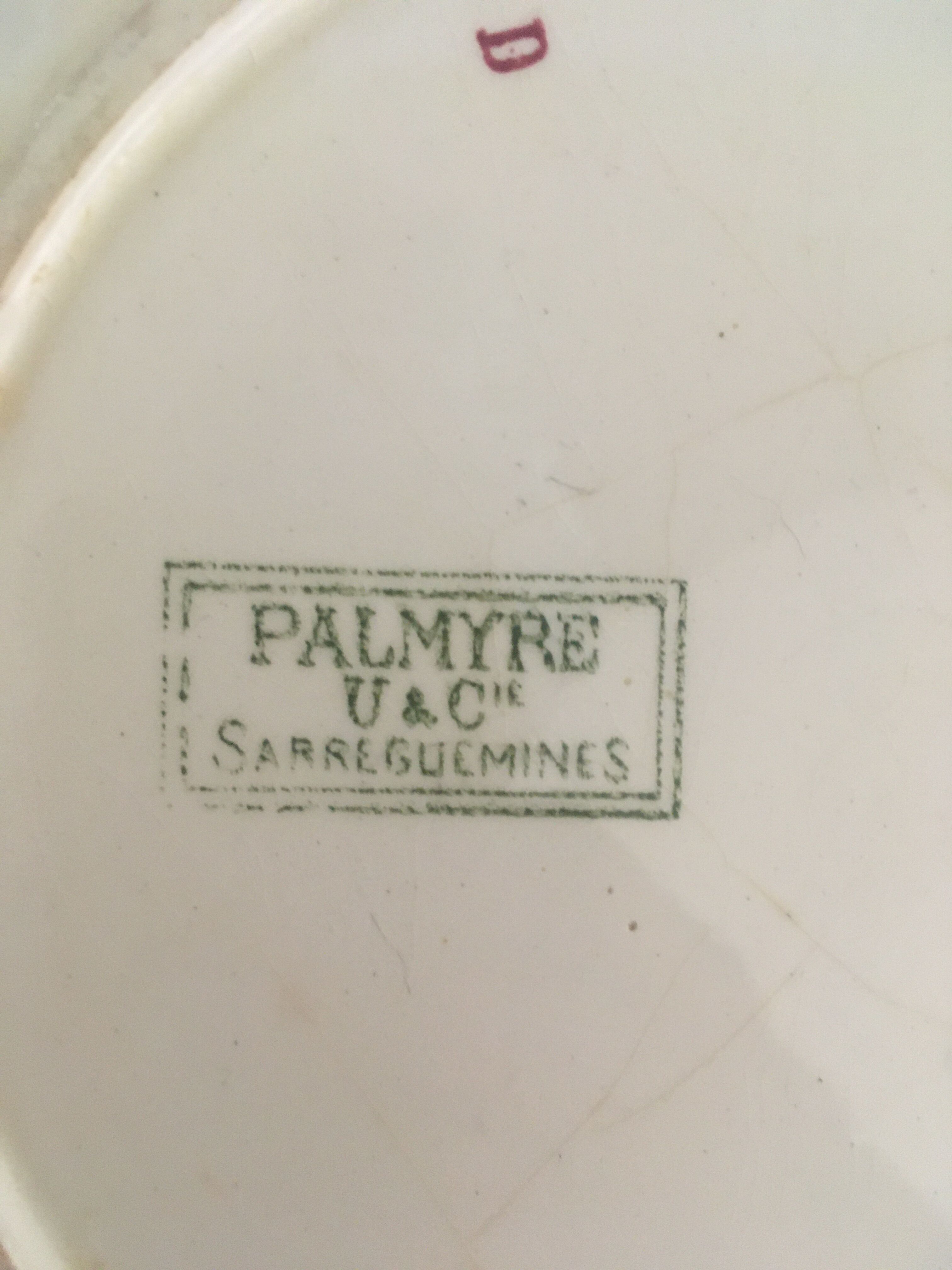 Flat old plates mismatched with flowers