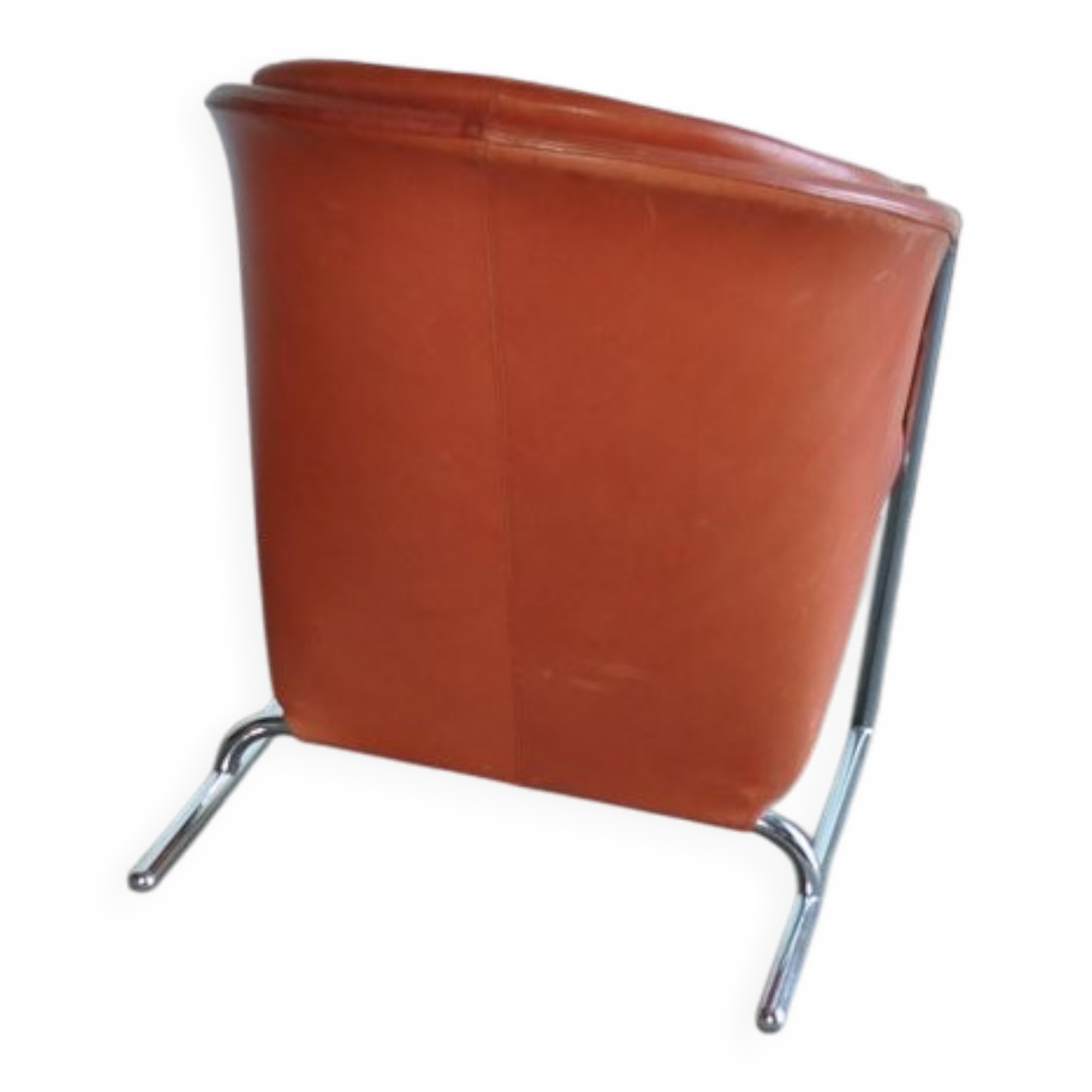 Mid-century coral leather armchair from the 1970s, tufted seat and chrome base.
