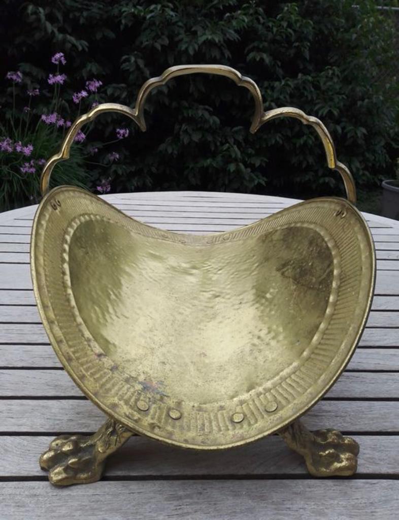 Old brass log holder