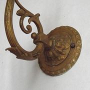 French Art Nouveau wall sconce in bronze with a white and pink glass shade.