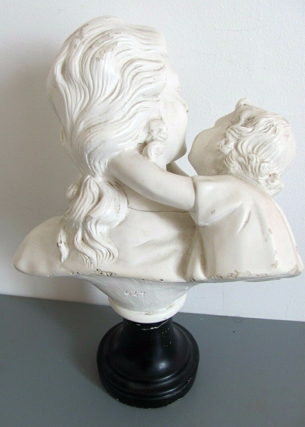 Sculpture in plaster, young mother and child