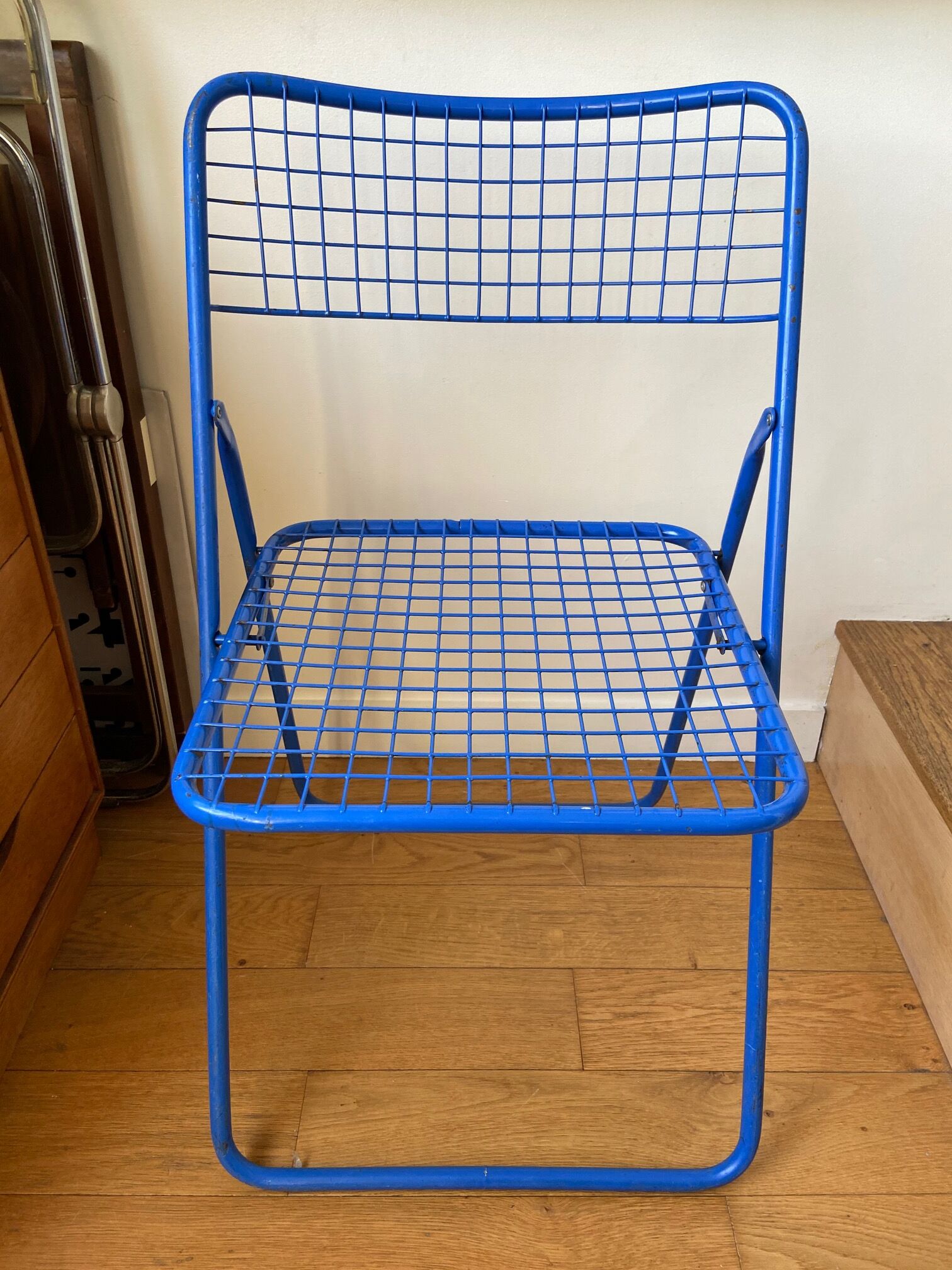 Blue "Ted Ned" folding chair by Niels Gammelgaard