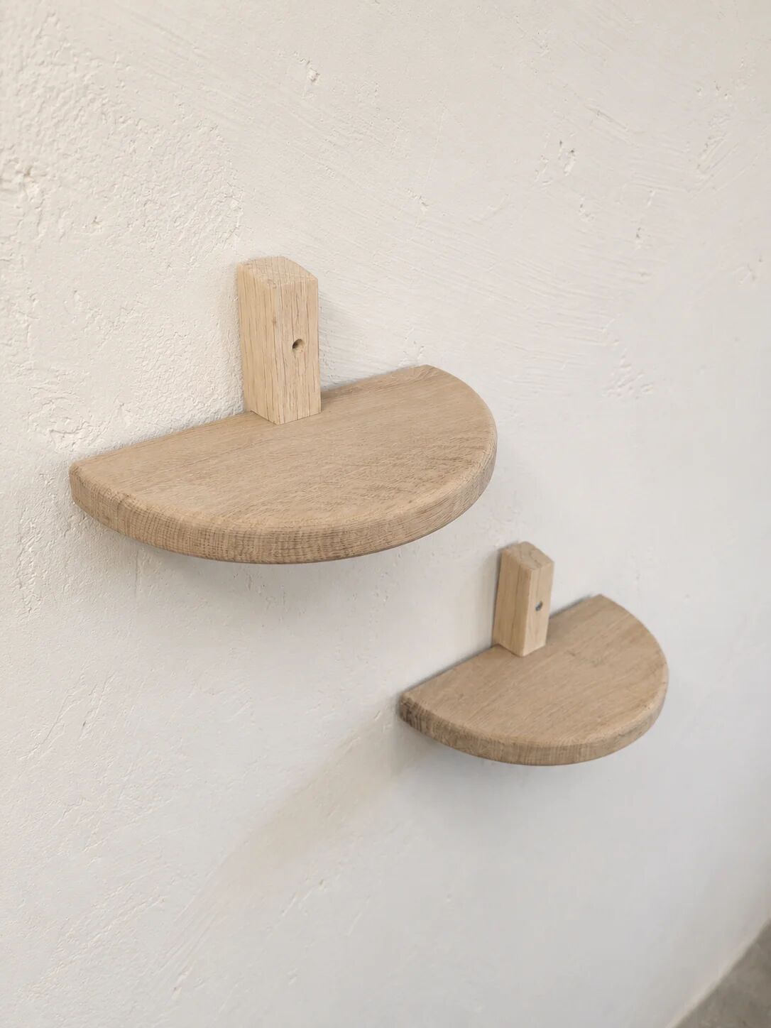 Pair of half-moon wall shelves in solid oak