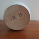 White enamelled earthenware flower vase signed HR