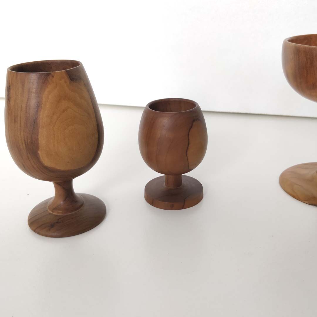Trio of egg cup glasses and Scandinavian wooden cup