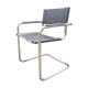 Fauteuil design à piétement tubulaire métallique chromé et assise en skaï noir