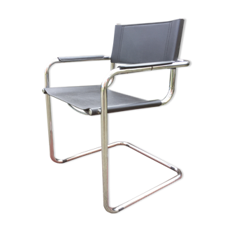 Design armchair with chrome metal tubular base and seat in black Skaï