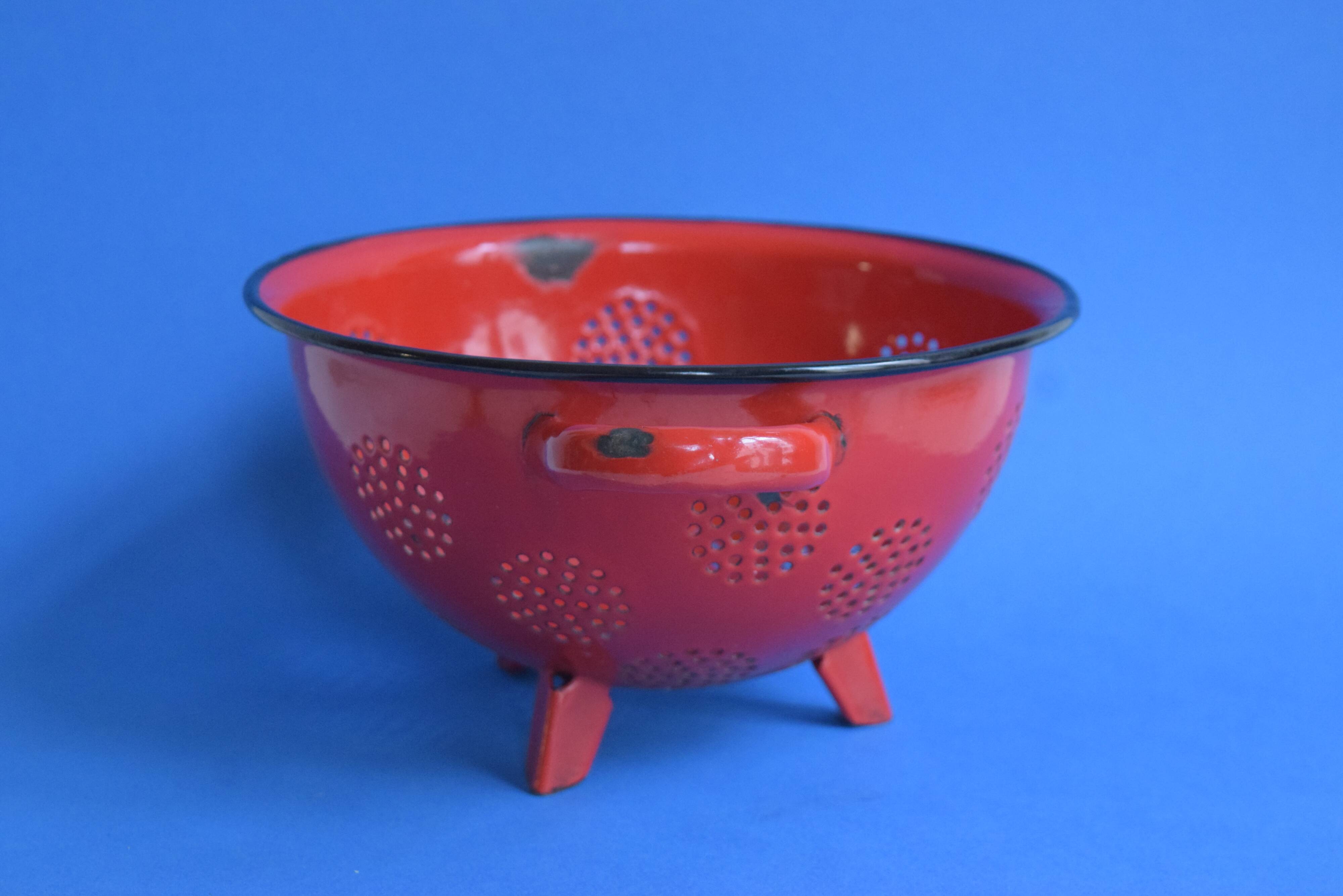 Vintage red enameled sheet metal colander