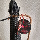 Glass bottle covered with black scoubidou with twisted golden handle - vintage