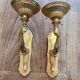 Paire d’appliques murales bronze bras tendus mains