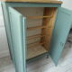 Vintage shoe cabinet smoked green wax finish, wooden top.