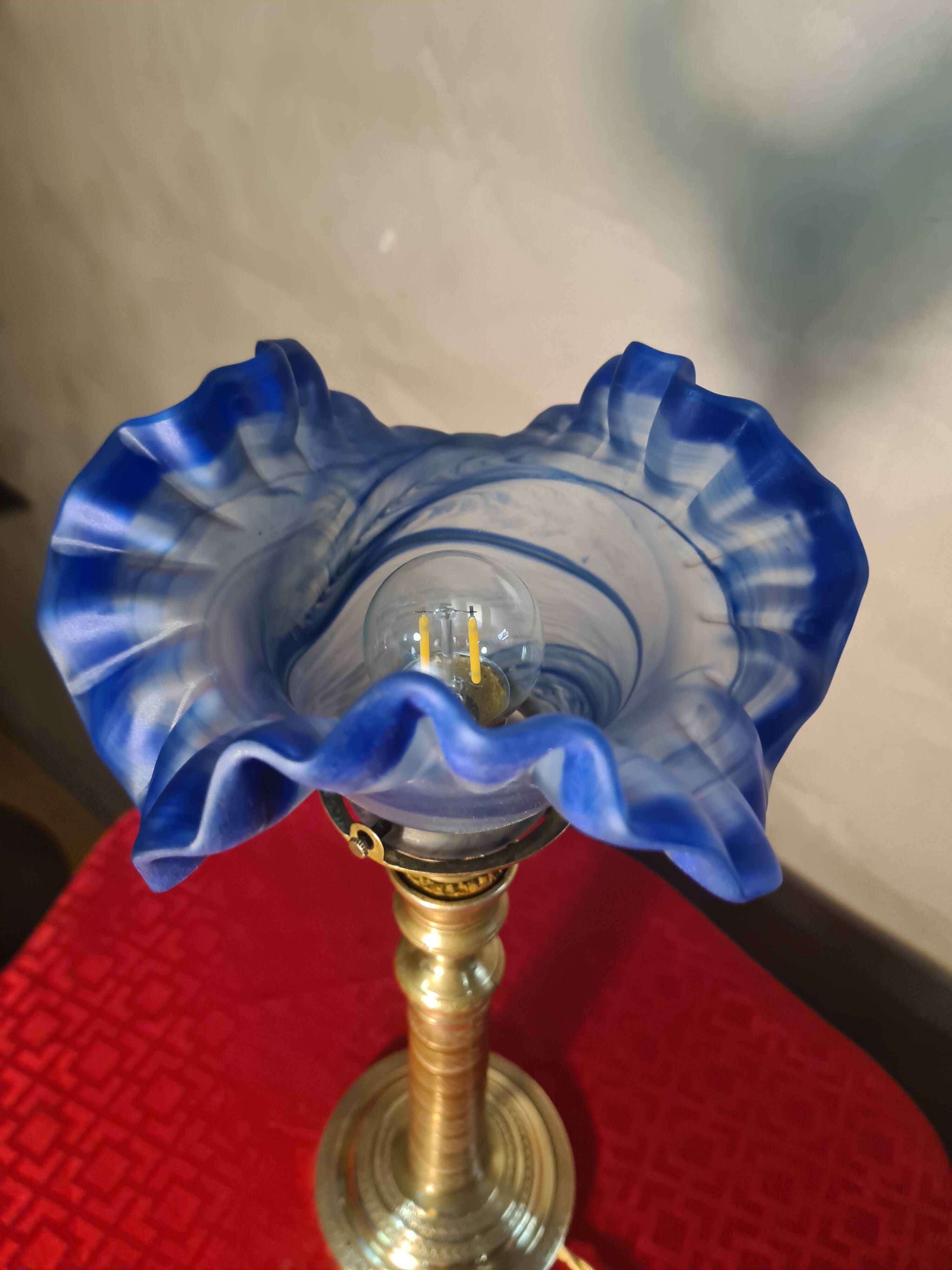 etched brass lamp with a blue satin glass tulip shade, signed Vianne 36x16