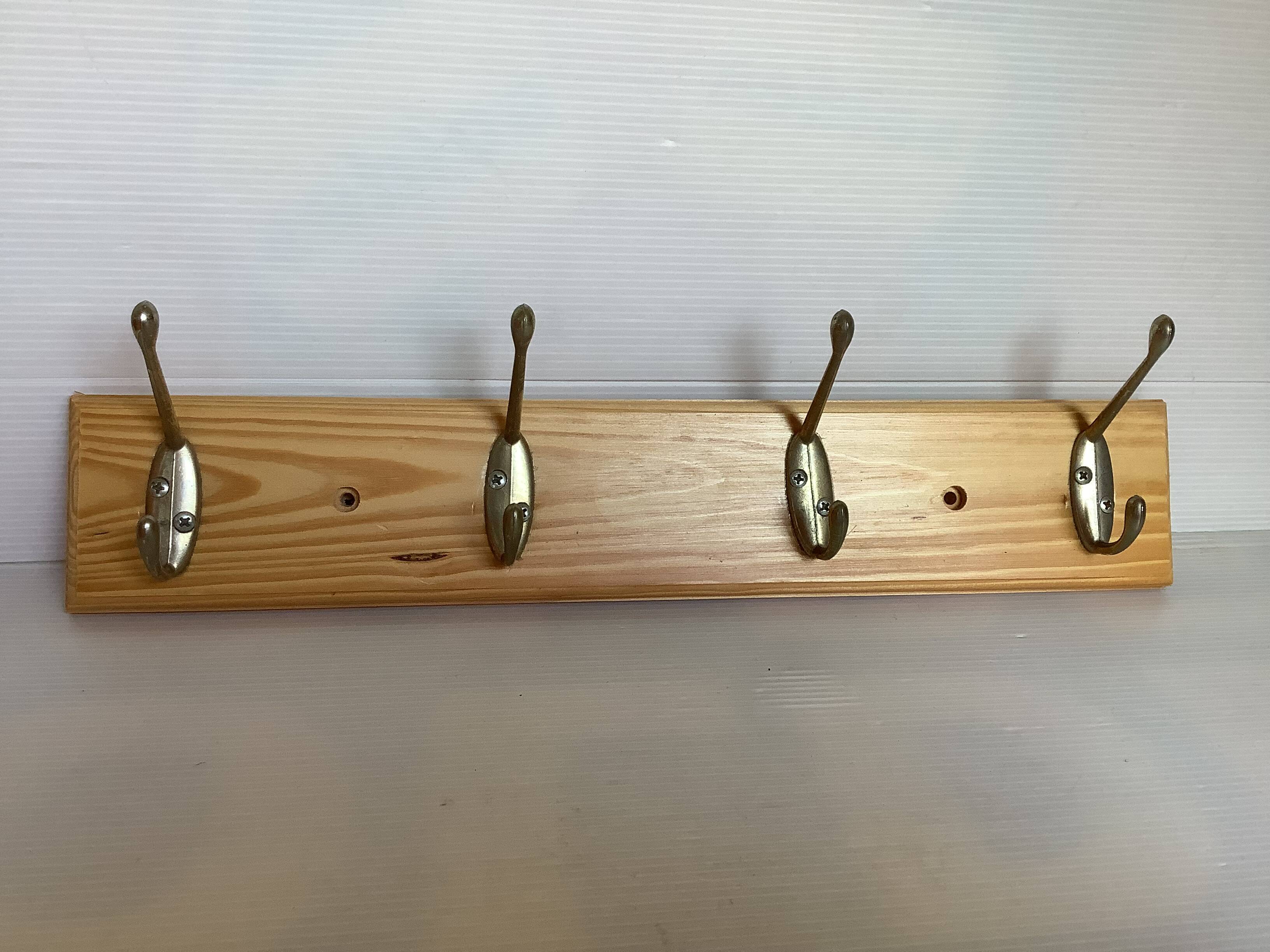 Wooden coat rack with four hooks