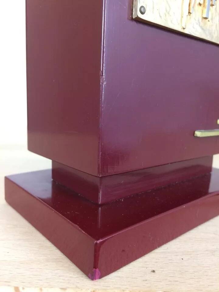 1980s vintage lamp base in red wood and gold metal.