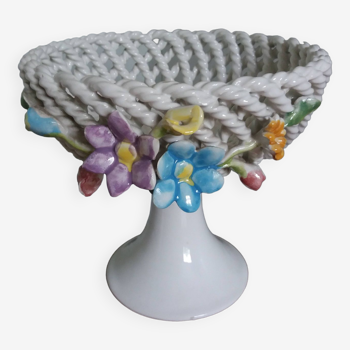 Cup on woven ceramic base with slip flowers
