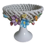 Cup on woven ceramic base with slip flowers