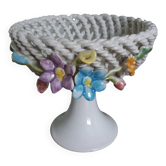 Cup on woven ceramic base with slip flowers