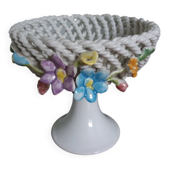 Cup on woven ceramic base with slip flowers