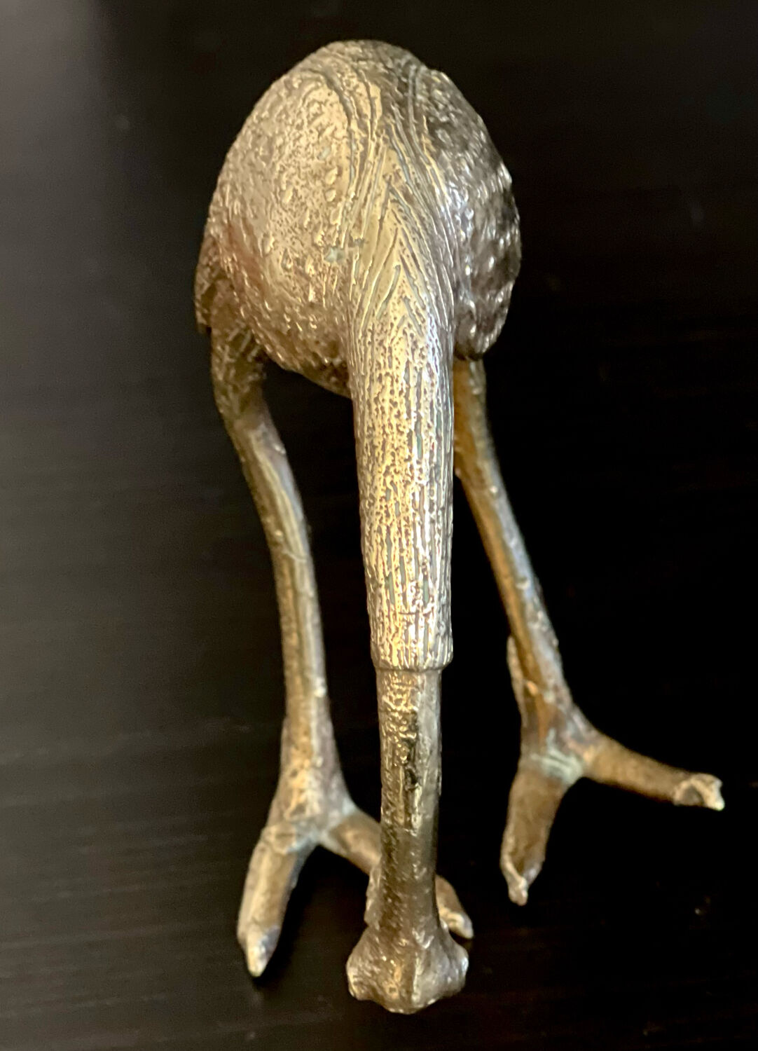 Heron in brass.