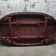 Oval Louis XVI style table with half-moon extensions.